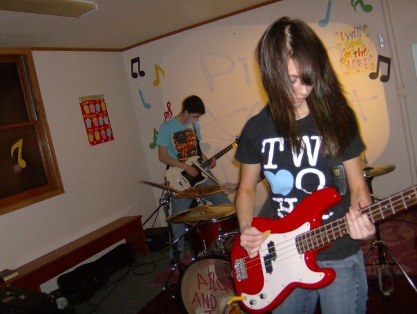 Photo of Elise Fajen playing Bass in her high school band.